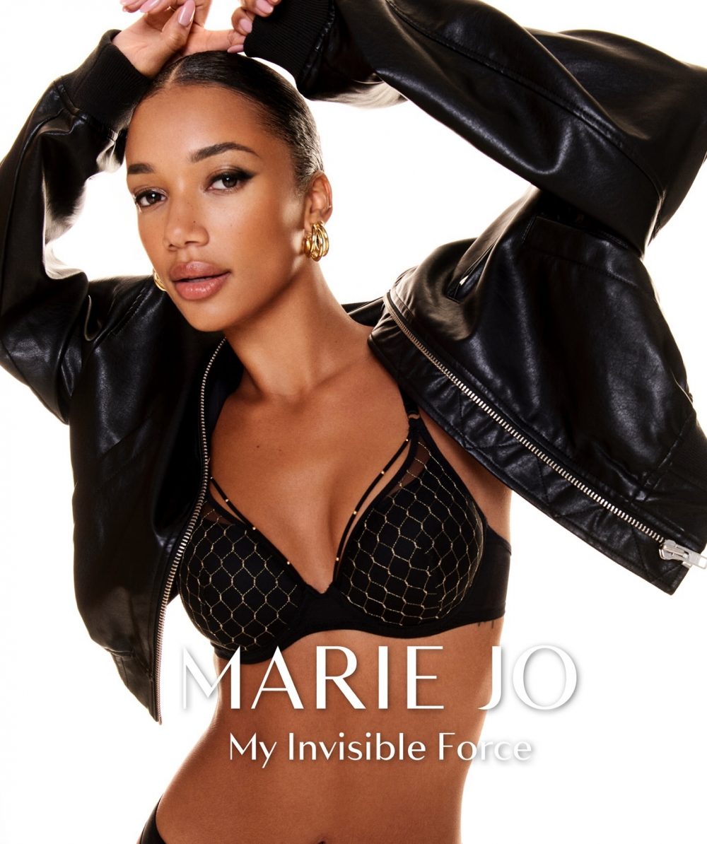 Cover photo of a model wearing a black leather jacket and a mesh-patterned black bra, with gold hoop earrings, posing with arms raised. The text at the bottom reads 'MARIE JO' and 'My Invisible Force'.