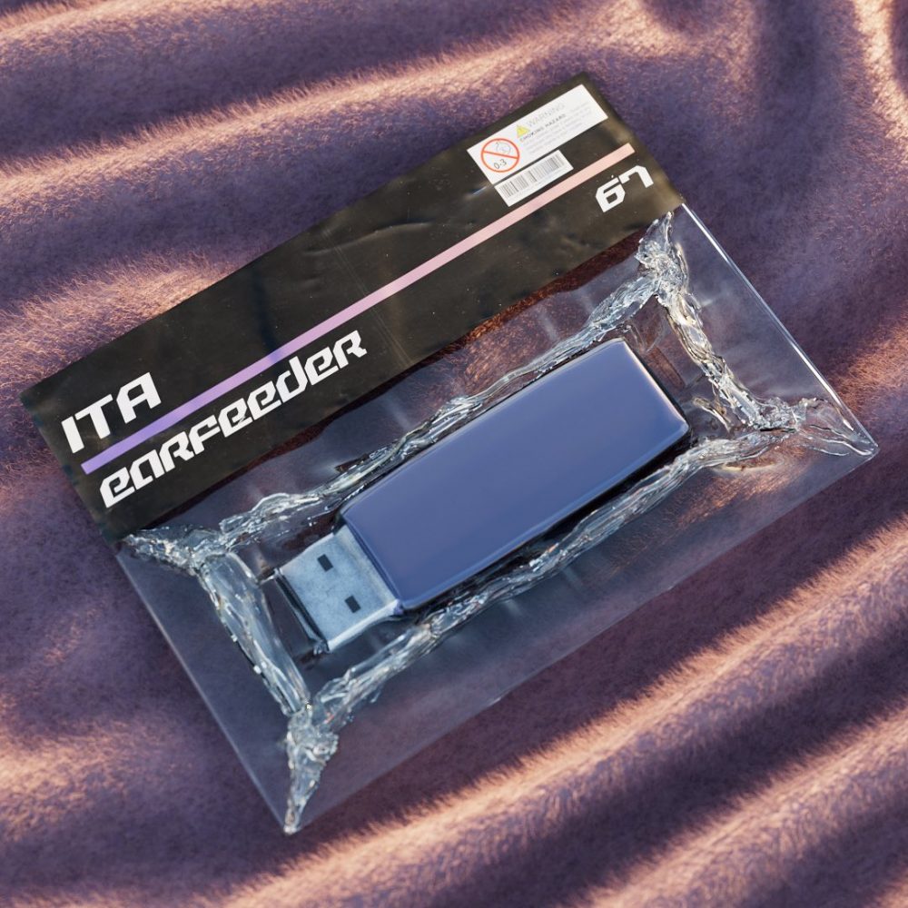 USB flash drive in clear packaging on purple fabric, brand reads 'ITA earfeeder' on black sleeve