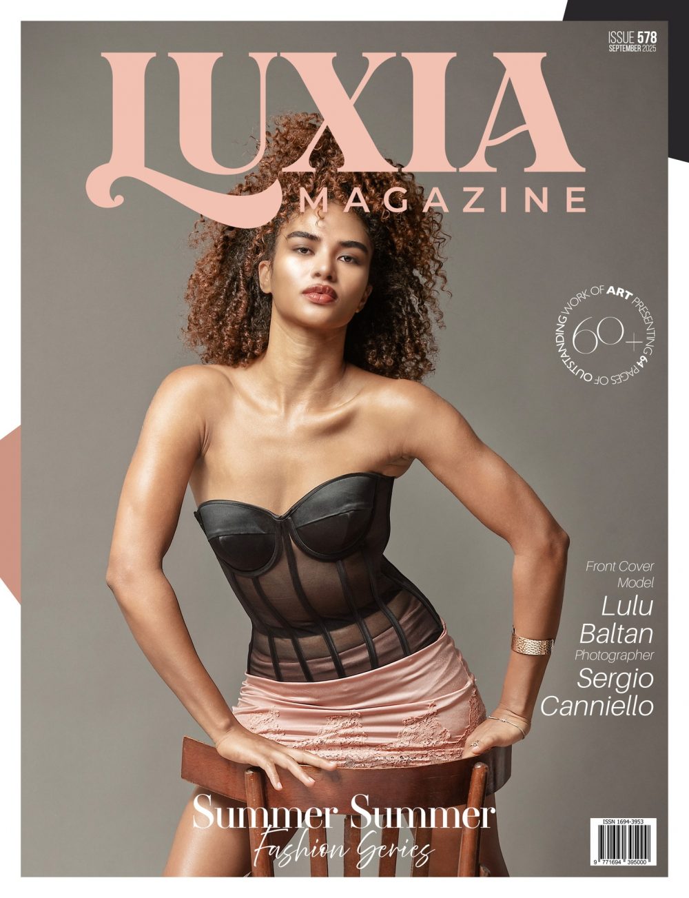 Cover of Luxia Magazine, September 2025, featuring a model in a black corset and pink skirt with large pink magazine masthead text and a barcode in the bottom corner.