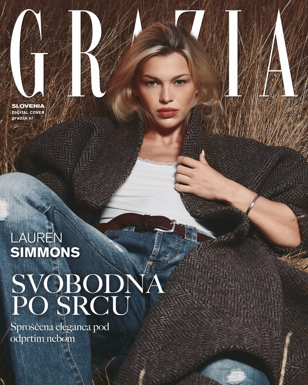 Fashion magazine cover: woman in a tweed coat lying in dry grass with large white title text across the image.